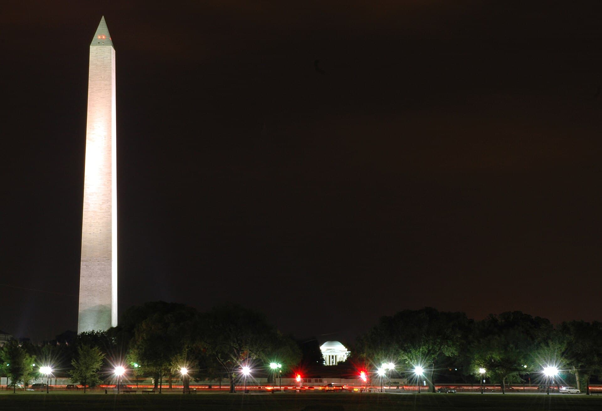 Washington Monument and Jefferson Memorial illuminated against the Washington, D.C. night sky