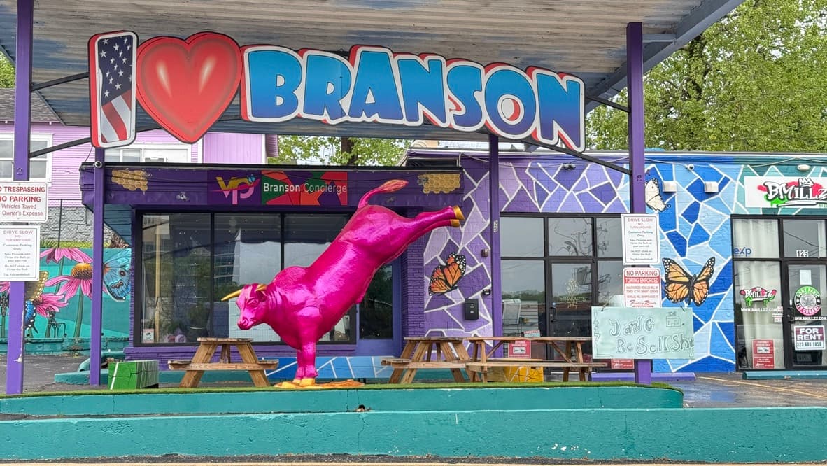 Colorful I Love Branson sign and pink chicken sculpture