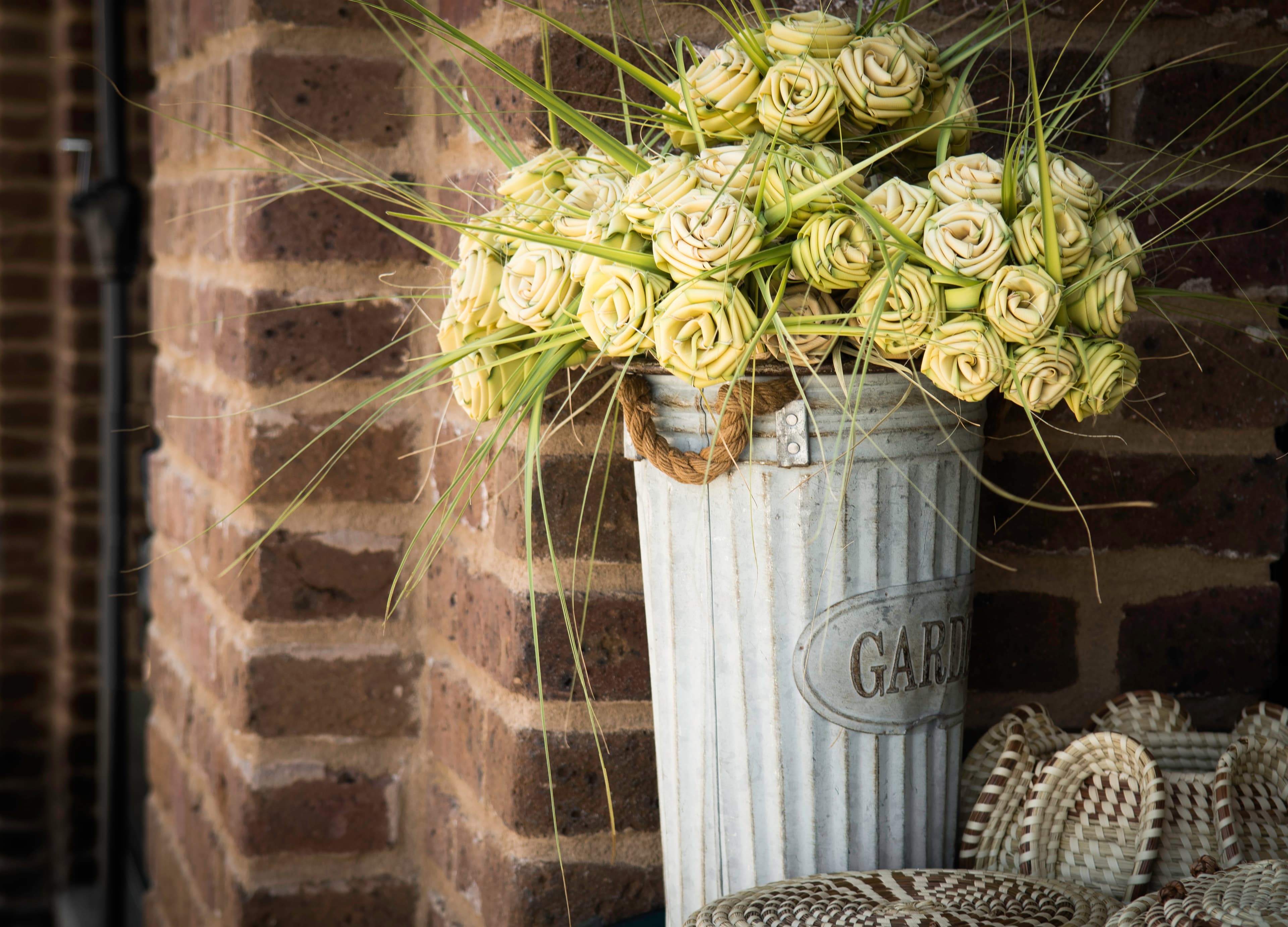 Sweetgrass roses and baskets displayed by an artisan at Charleston City Market