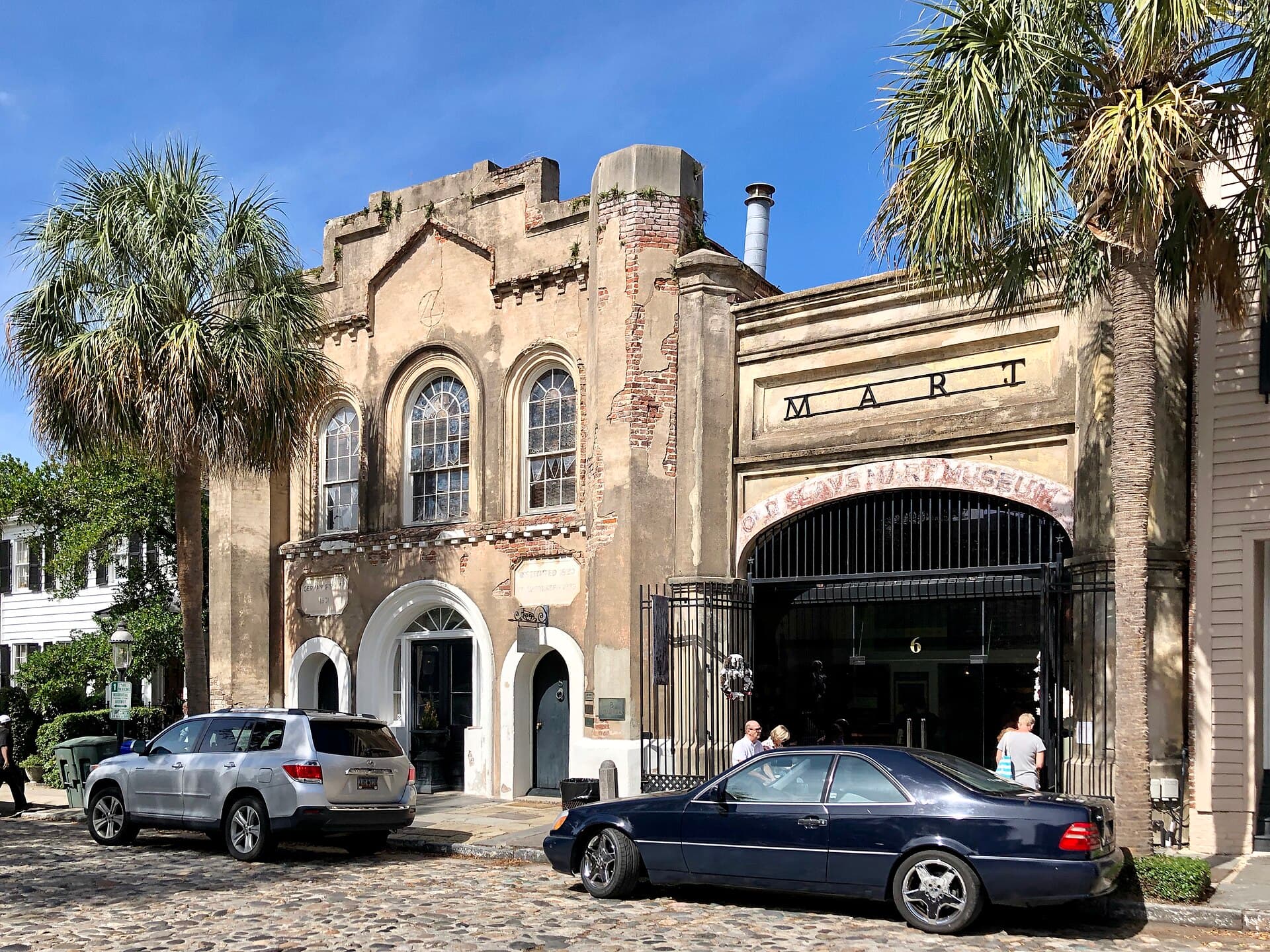 The arched facade and entrance of the Old Slave Mart Museum on Chalmers Street in Charleston