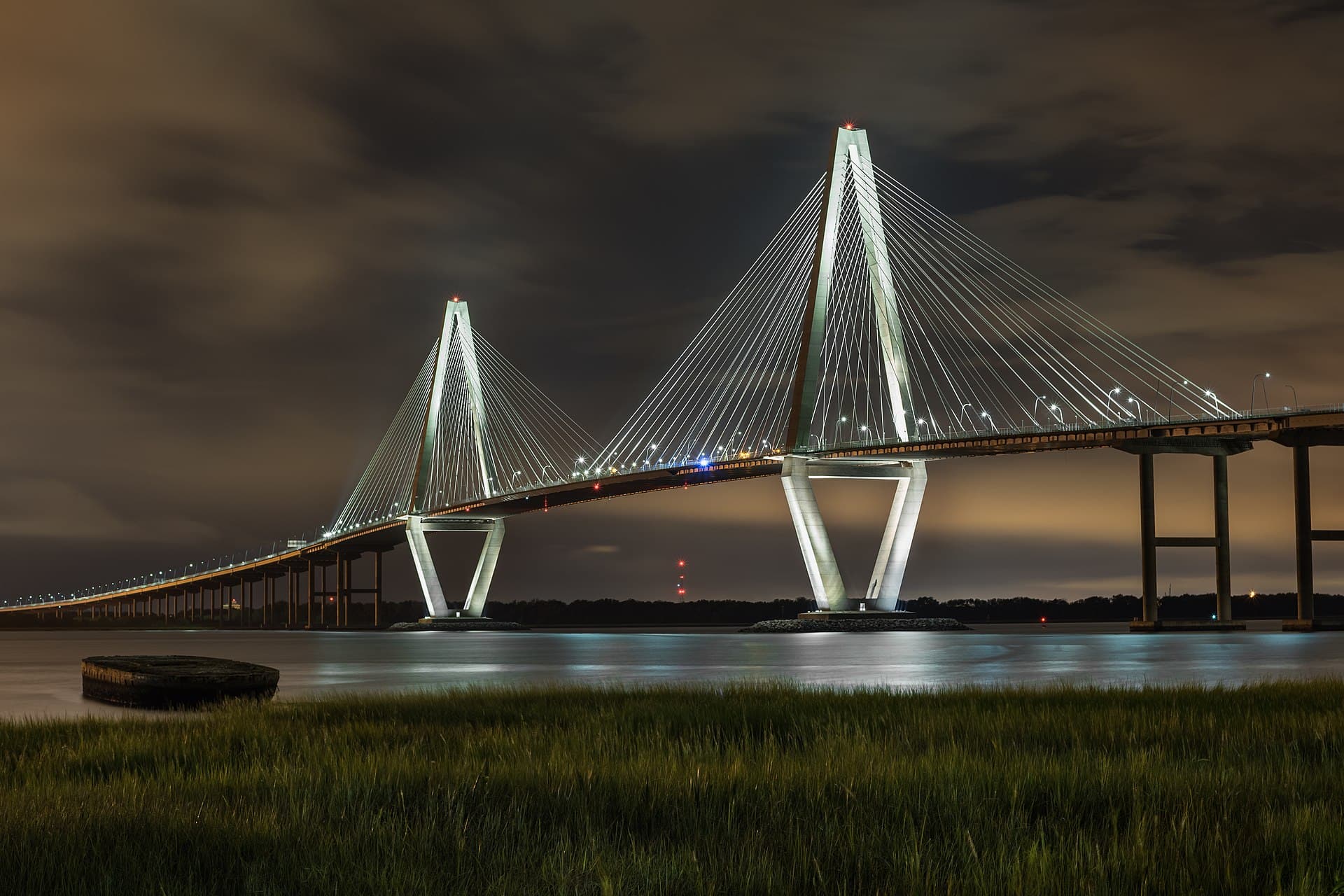 Arthur Ravenel Jr. Bridge illuminated at night over the Cooper River