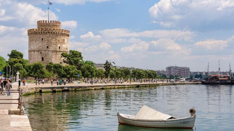 The White Tower reflected in the water along Thessaloniki’s waterfront