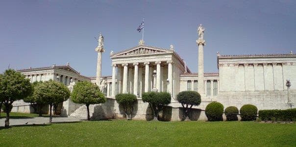 The neoclassical Academy of Athens with statues and columns