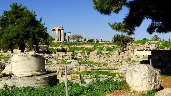 Ruins and standing columns within the archaeological site of Ancient Corinth