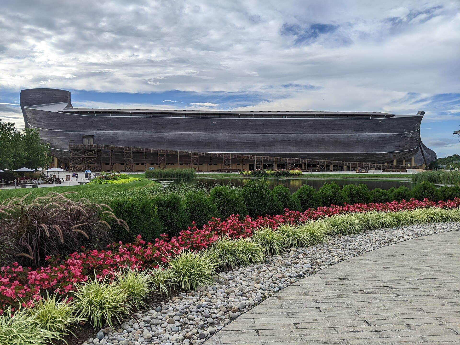 Life-size Noah's Ark at the Ark Encounter seen across the lake and gardens