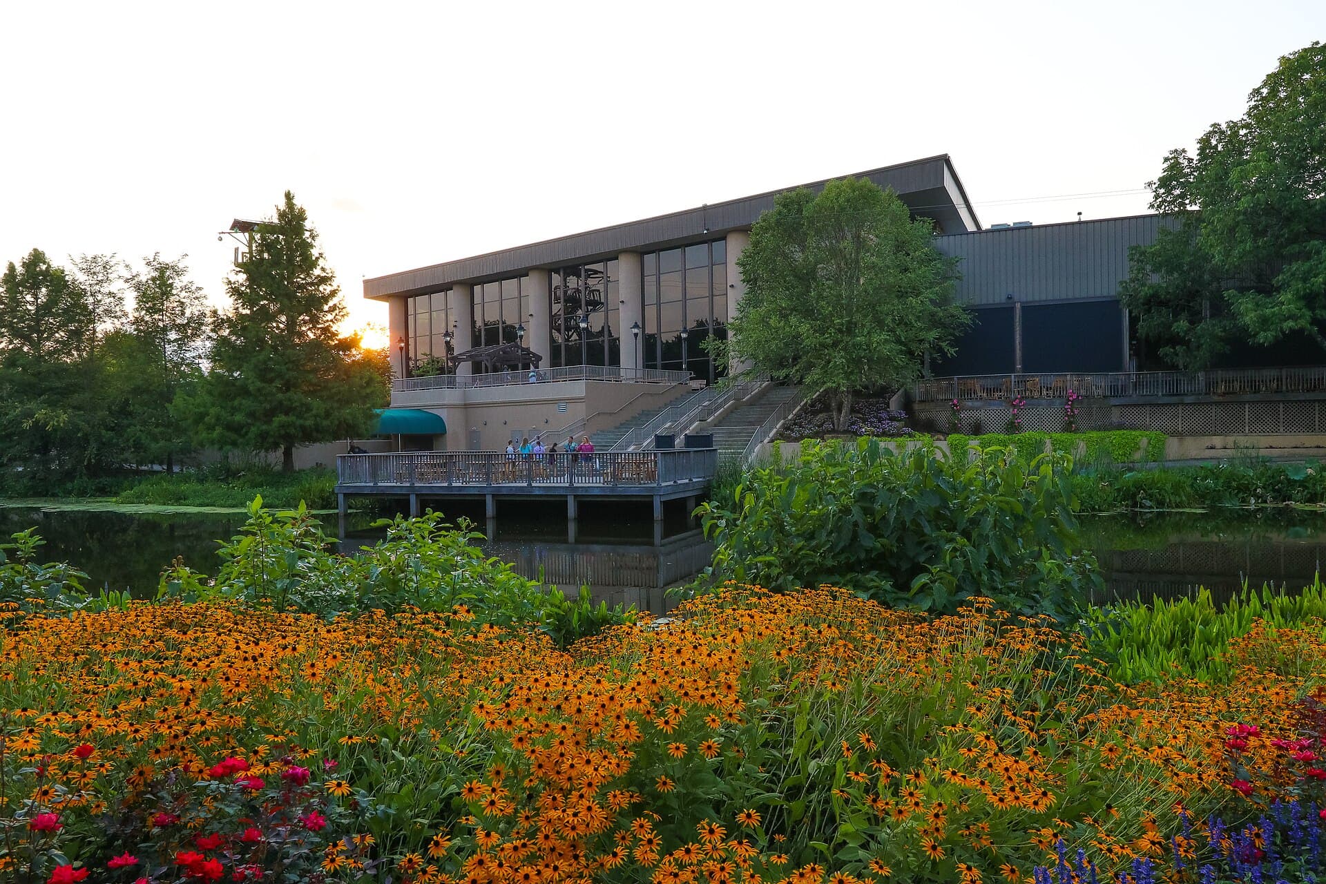 Creation Museum overlooking its botanical gardens and pond at sunset