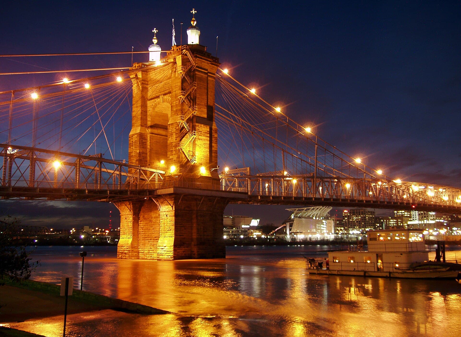John A. Roebling Suspension Bridge illuminated at night over the Ohio River
